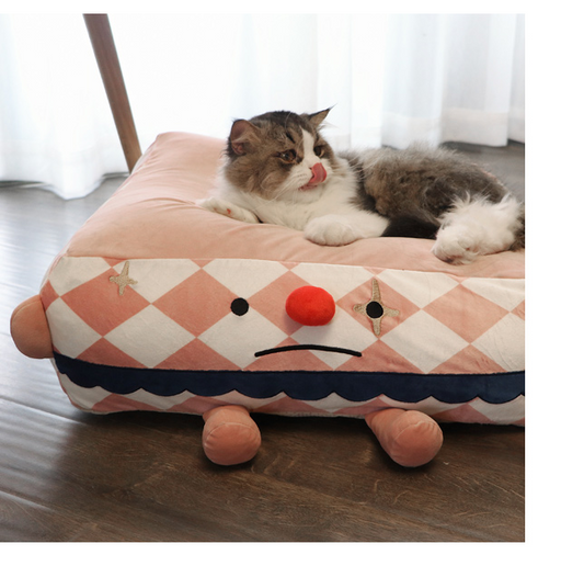 Clown Sleeps In A Cozy Pet Bed - Paws Claw Snawws